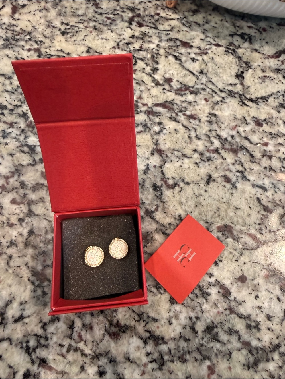 NEW CAROLINA HERRERA MOTHER OF PEARL STUDS.